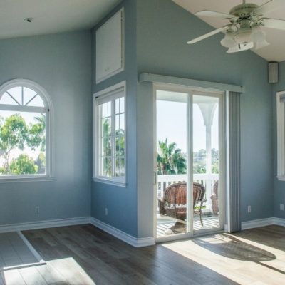 trendy-modern-interior-of-living-room-with-blue-walls-and-white-windows